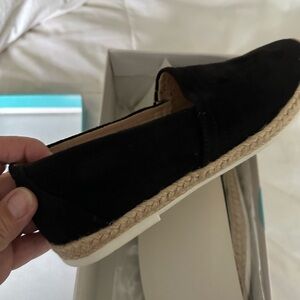 Slip on black suede flat shoe